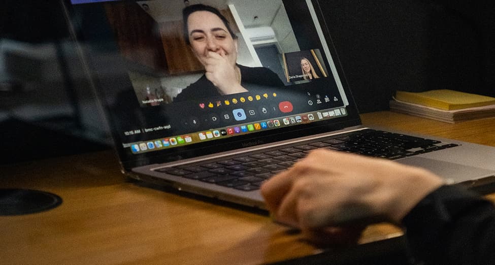 A remote collaboration call displayed on a laptop